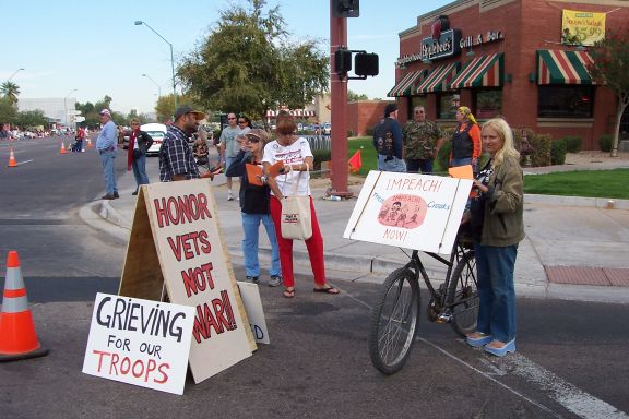 veterans_day_march_phx-anti_war_marchers_11-12-07_bicyclist_and_signs.jpg 