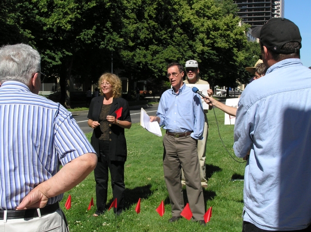 640_debra_cres_interview_w_flags_in_ground.jpg original image ( 2288x1712)