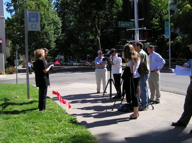 640_debra_w_flags_and_reporters.jpg original image ( 2288x1712)