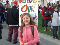 young_girl_save_our_schools_sign.jpg