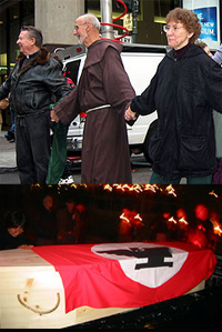 Father Bill (left) taking direct action in front of the San Francisco Stock Exchange March 14, 2003
