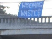 Banner Hung to Protest Highway 1 Wideing in Santa Cruz