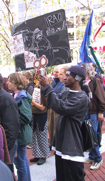 121002_oakfed_nowar_07_oil_industry_gwb_iraq_sign.jpg 