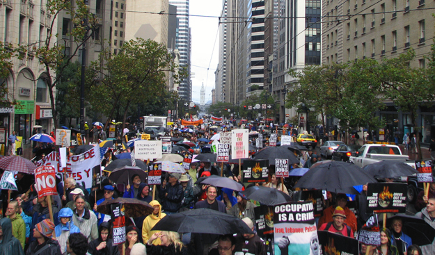 Thousands braved the cold rain in San Francisco today to say "Bush Step Down" and "Drive Out the Bush Regime".
As part of a "national day of mass resistance" San Francisco was one of of over 2