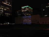Thursday and Friday evening in busy downtown Portland, a giant advertising projector illuminated the provocative message that PacifiCorp (Pacific Power), owner of the Klamath dams, is destroying Nativ