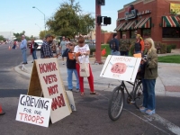 veterans_day_march_phx-anti_war_marchers_11-12-07_bicyclist_and_signs.jpg