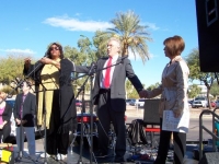 hugs_for_peace_rally-state_capitol_phx_az_1-13-08_stage-singer_and_leaders.jpg