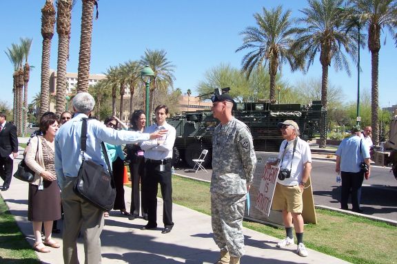 phoenix_protesters_confront_yuma_az_military_3-26-08_protester_and_military_1.jpg 