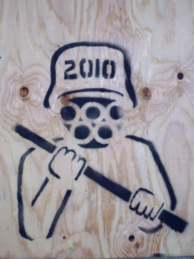 2010_riot_cop_stencil_wood_0.jpg 