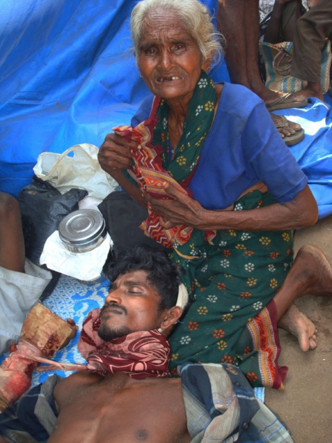 640_old_woman_caring_her_son_who_had_neck_injury_11_may_2009.jpg 