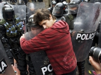 200_protester-hugging-cop.jpg