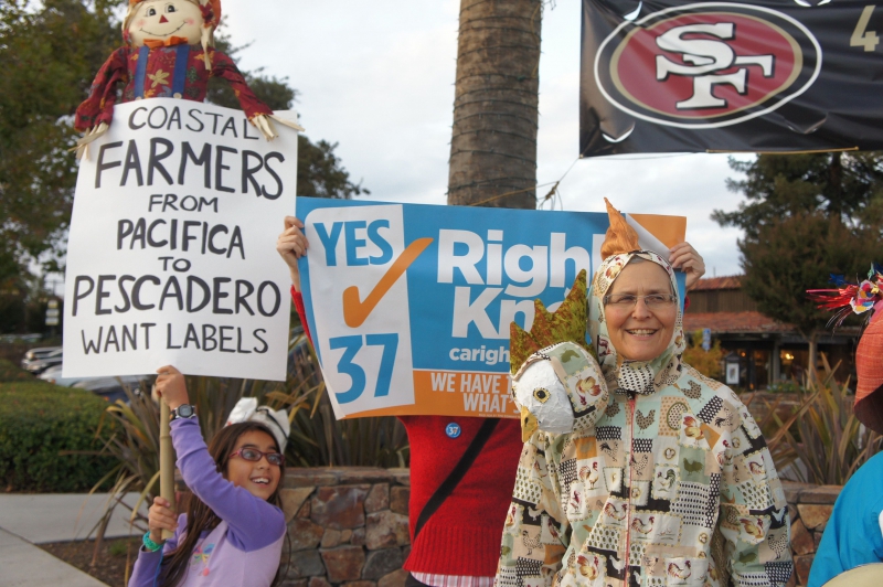800_prop37chickenhandfarmers.jpg