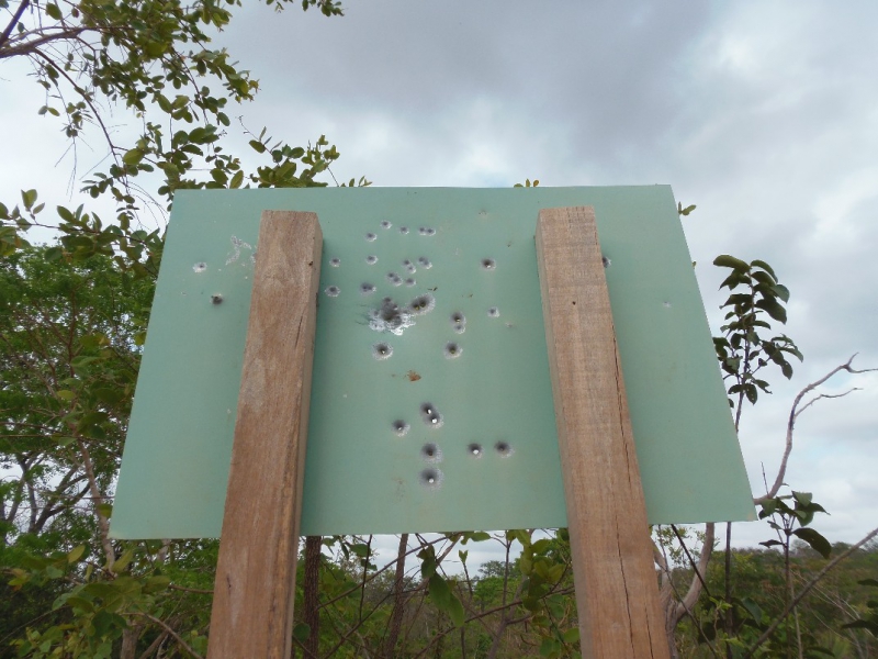800_the_bullet-ridden_entrance_sign_to_indigenous_reserve_governador.jpg 