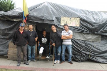 colombian-workers-injured_in_front_of_tent.jpg 