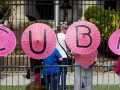 481414734-code-pink-demonstrators-hold-up-umbrellas-gettyimages.jpg