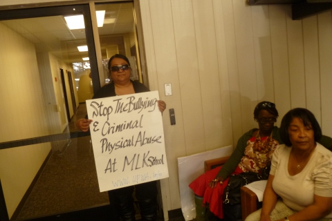 480_ctc_nancy_with_placard_in_lobby.jpg
