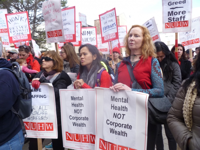 sm_nuhw_members_with_picket_signs.jpg