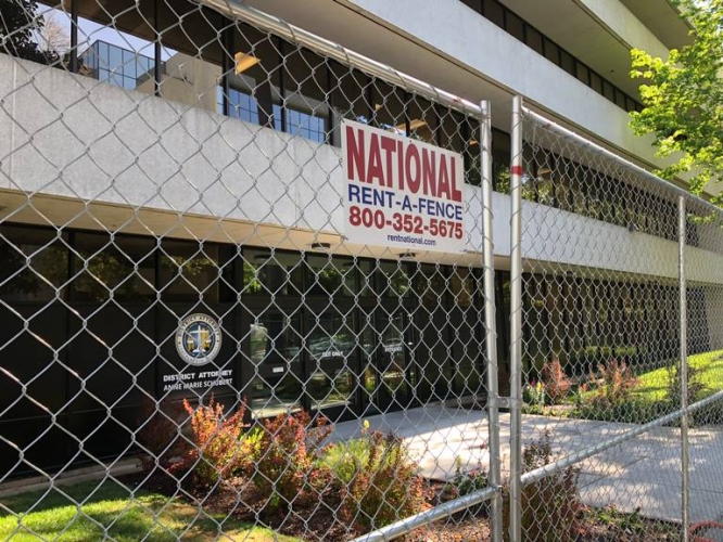 sm_sacramento_district_attorneys_office_protester_fence.jpg 