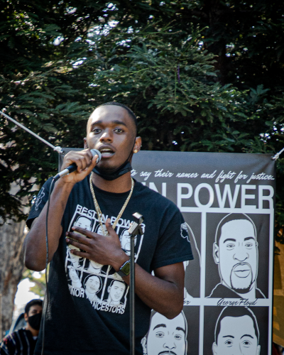sm_18._student_rawhawn_smith_speaks_to_the_crowd.jpg