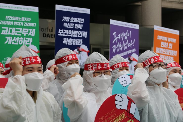 korean_health_care_workers_fists.jpeg 
