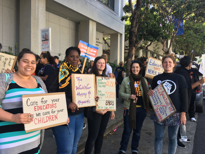 sm_uesf_teeachers_with_signs5-9-17.jpg 