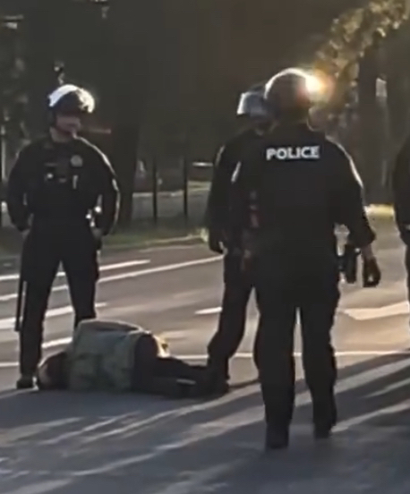 A protester laying unconcious on the ground