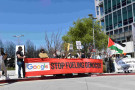 Red Stop fueling genocide banner