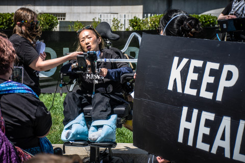 Asian American woman in wheel chair 