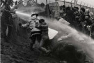 Bitter tear gas clawed at our eyes as National Guard clubs smashed against our frames. Several thousand arrived in this little New Hampsh...