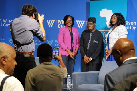 Posing with admirers.