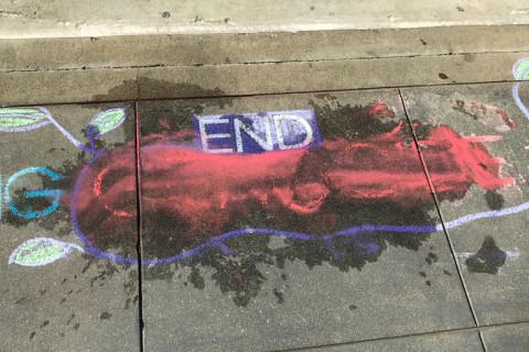 a triggered Zionist dumped water on this to blur the word "Genocide"