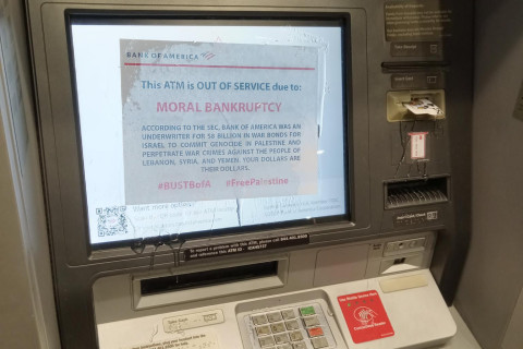 A photo of a BoA ATM that has a message epoxied to its screen. The card reader and keys have been disabled with epoxy as well.