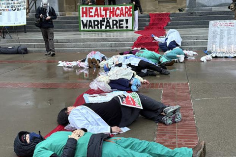 Health Care workers die-in at the State Capitol. Photo by Dan Bacher.