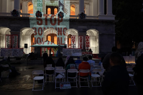The slogan "Stop Bombing Hospitals" was projected onto the Capitol. Photo by Dan Bacher.