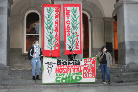 A number of banners like these were displayed at the event. Photo by Dan Bacher.