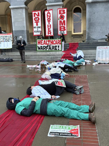 Health Care workers die-in at the State Capitol. Photo by Dan Bacher.