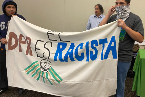 FLOC protesters unfurl "DPR is racist" banner