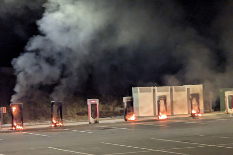 Photograph of multiple Tesla charging stations on fire in Littleton, Massachusetts