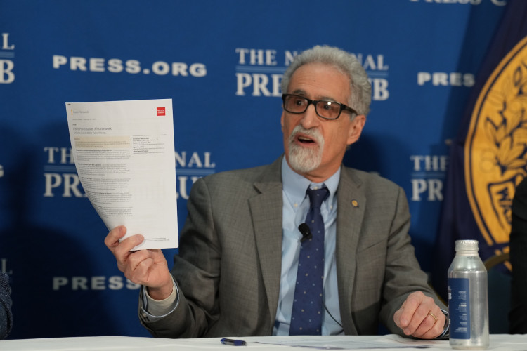 American Postal Workers Union President Mark Dimondstein held up a memo from Wells Fargo Bank analyzing privatization.