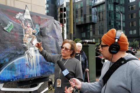 Artist Andrew Kong Knight with his Musk to Mars painting.