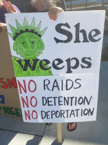 Poster of Statue of Liberty crying with the text no raids no detention no deportation