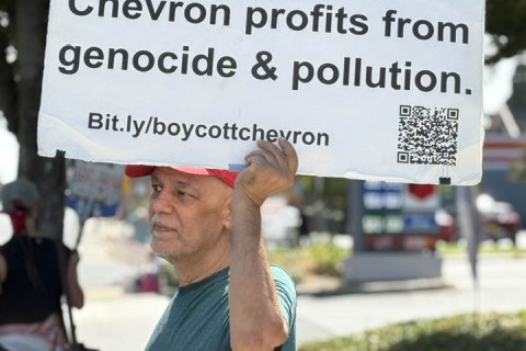 Chevron profits from genocide and pollution