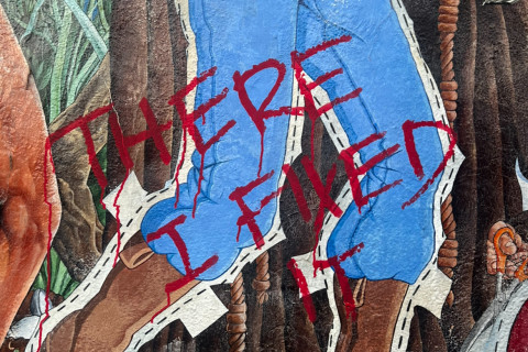 The words “There I Fixed It” in red paint