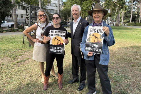 "Big Oil Runs This Town" sign