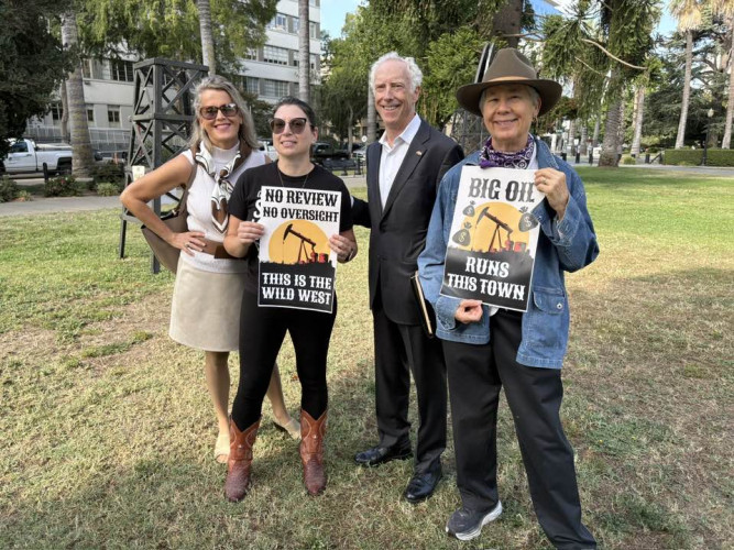 "Big Oil Runs This Town" sign