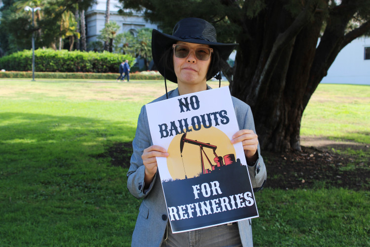 Cat Shaw holding sign