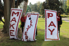 Third Act Sacramento holding Make Polluters Pay banners