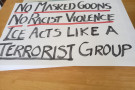Sign that says No Masked Goons, No Racist Violence, ICE acts like a Terrorist Group