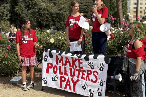 Students display their Make Polluters Pay banner
