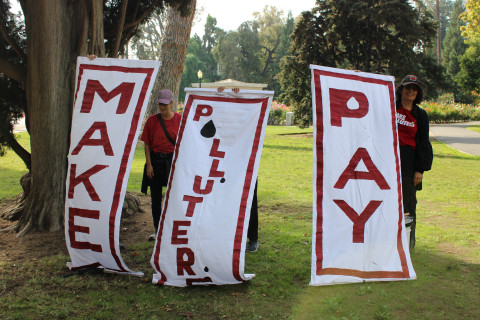 Third Act Sacramento holding Make Polluters Pay banners